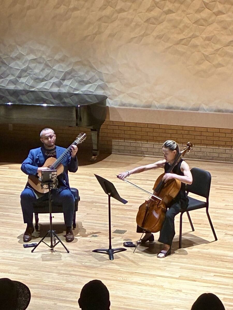 Close-up of Andrés Arcila and cellist performing chamber music