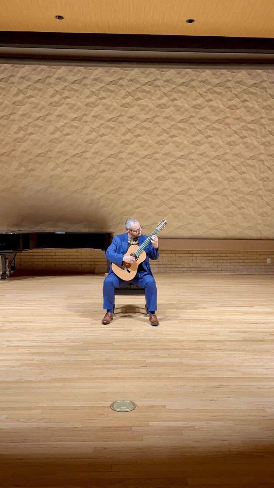 Wide view of solo classical guitar recital at University of North Texas